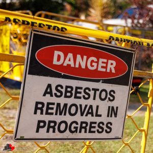 a sign blocking off a property that is about to undergo asbestos removal from Canada's Restoration Services in Edmonton